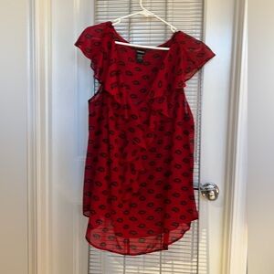 Red and black sheer blouse.
